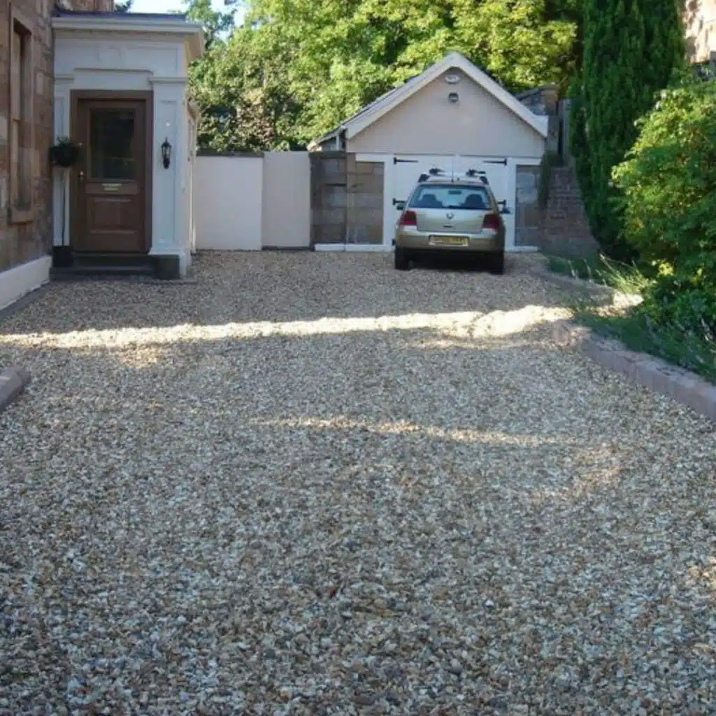 Curved shingle driveway with block border